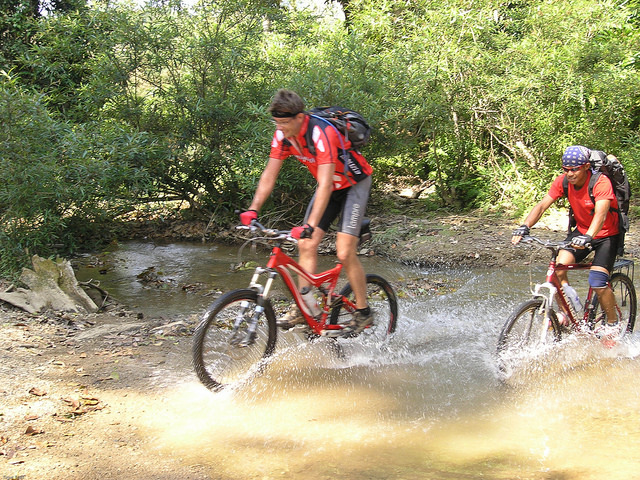 biking men riding lao mountain