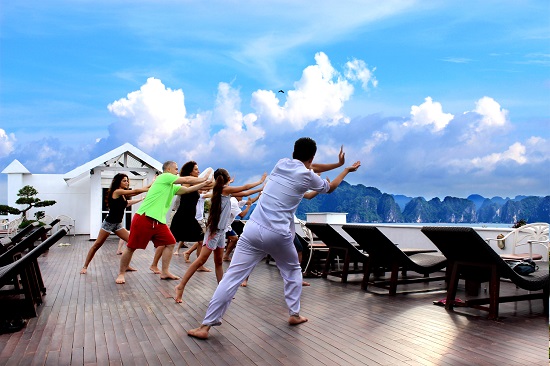 Tai Chi exercise in Halong bay cruise sundeck
