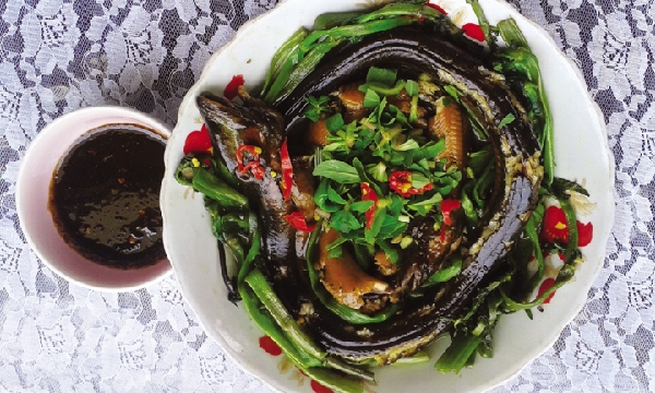 Braised eel served with buffalo spinach, a famous food of Ca Mau