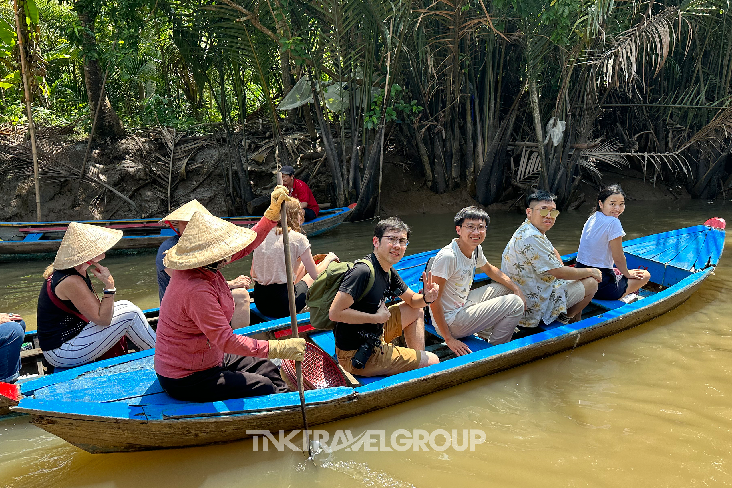 Riding a hand-rowed sampan through Thoi Son canal	